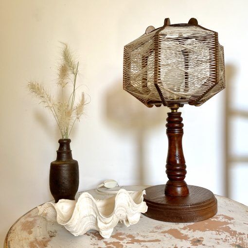 Wooden lamp and stretched wires