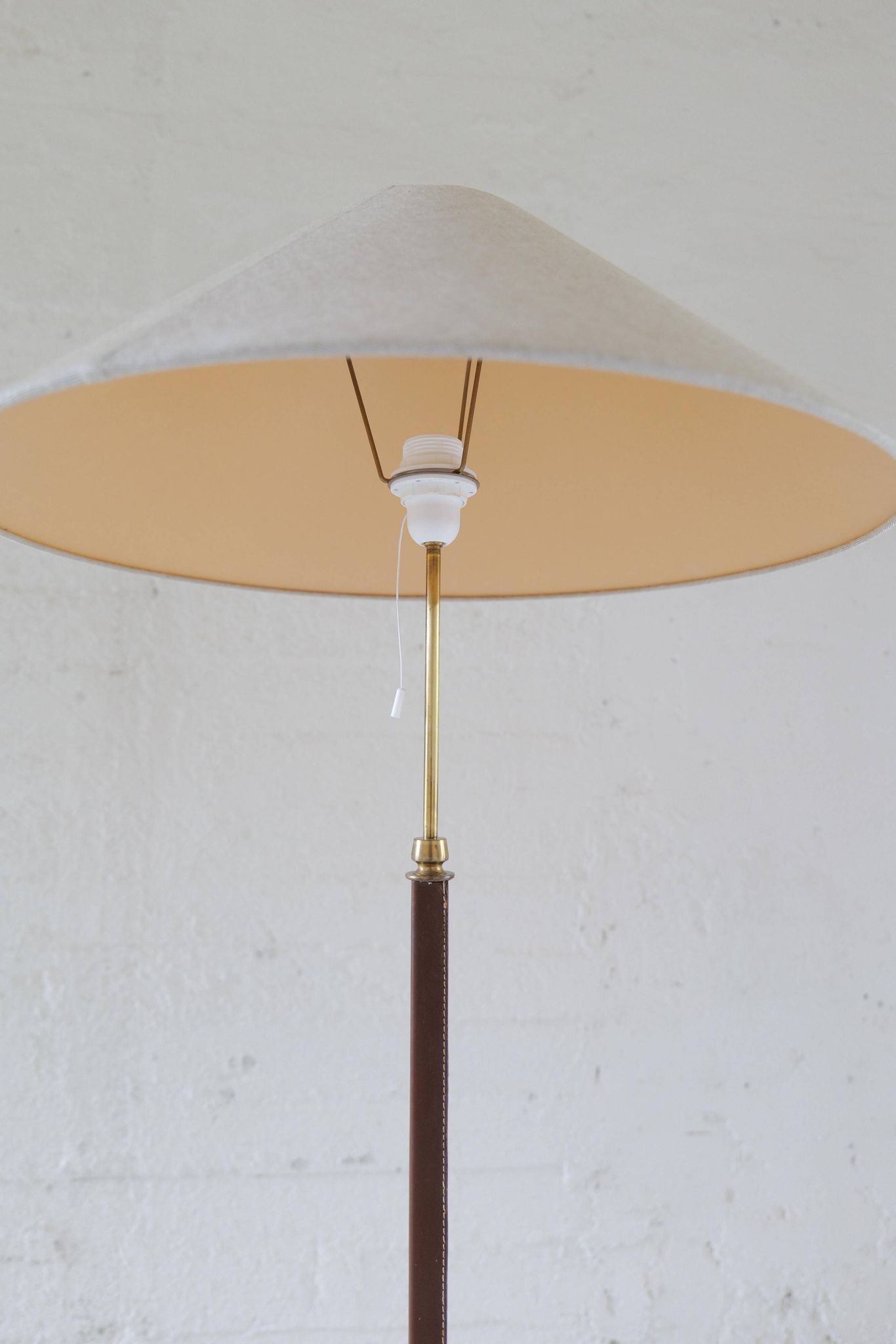 Mid-century brown leather and patinated brass floor lamp by Falkenbergs Belysning, Sweden, 1960s.