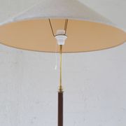 Mid-century brown leather and patinated brass floor lamp by Falkenbergs Belysning, Sweden, 1960s.