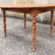 Round solid oak table with extensions, cabinetmaker's sliding mechanism,