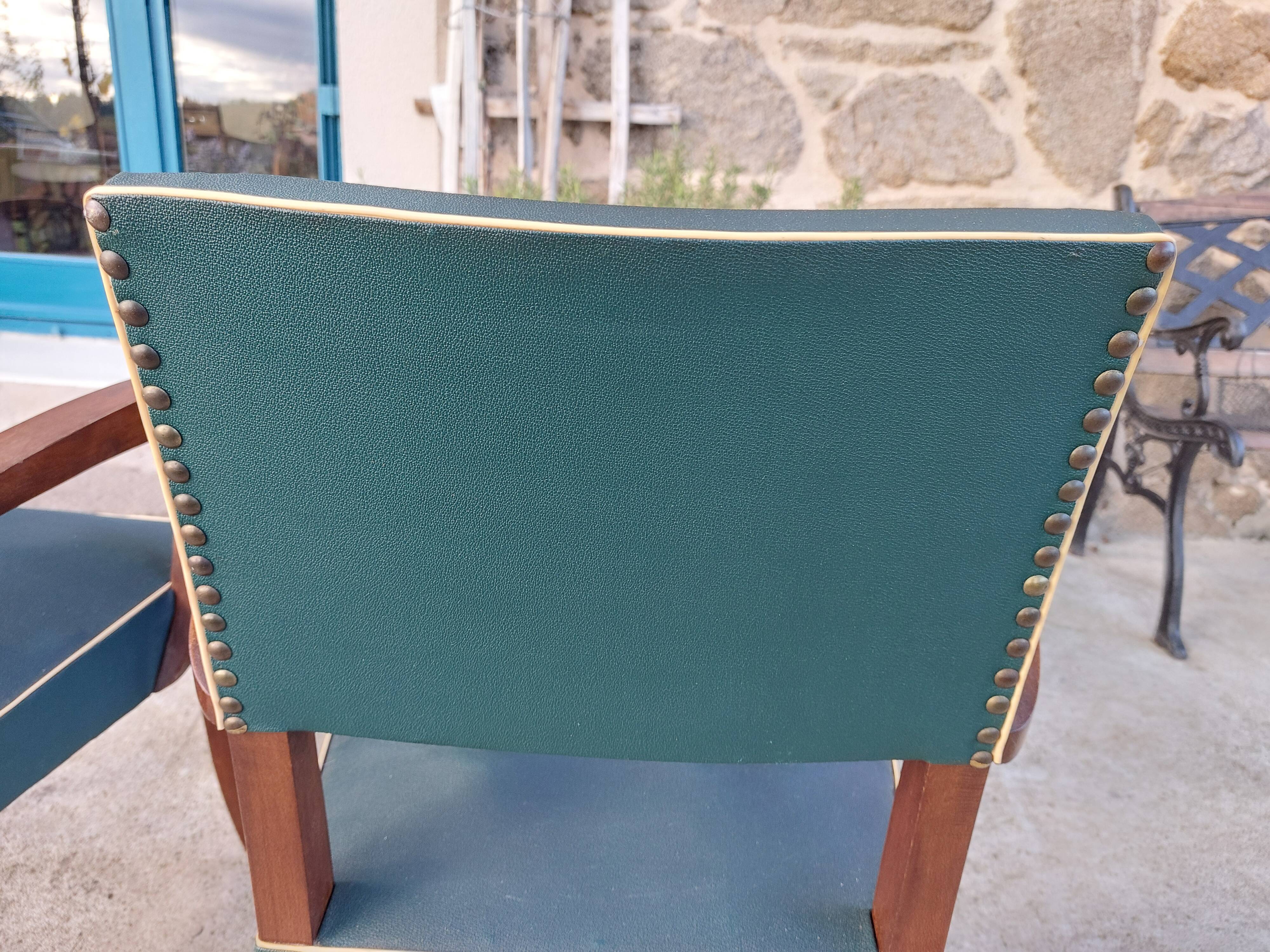 pair of dark green bridge armchairs