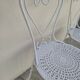 Pair of wrought iron garden chairs, antique manufacture