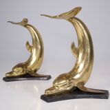 Solid brass dolphin console feet.