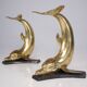 Solid brass dolphin console feet.