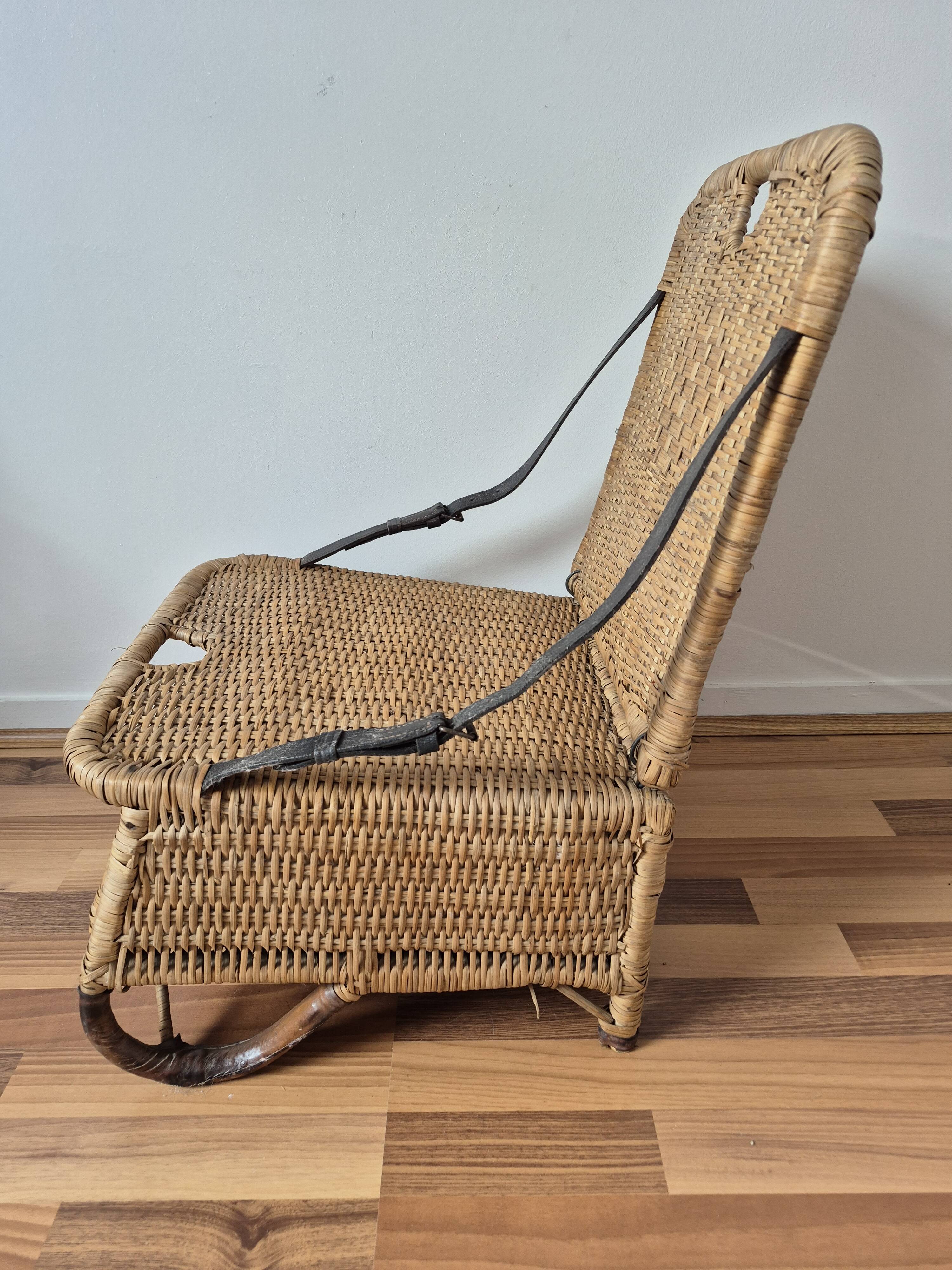 Vintage foldable beach chair, picnic in rattan and leather.