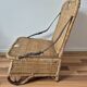 Vintage foldable beach chair, picnic in rattan and leather.