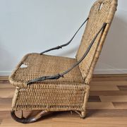 Vintage foldable beach chair, picnic in rattan and leather.