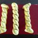 12 yellow and gold ceramic knife rests in their case from the 1950s.
