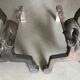 Pair of bronze fireplace firedogs with fleur-de-lys decor, art deco