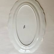 Shaped plates and dishes in Sarreguemines earthenware.