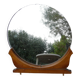 Round mirror on 60's furniture