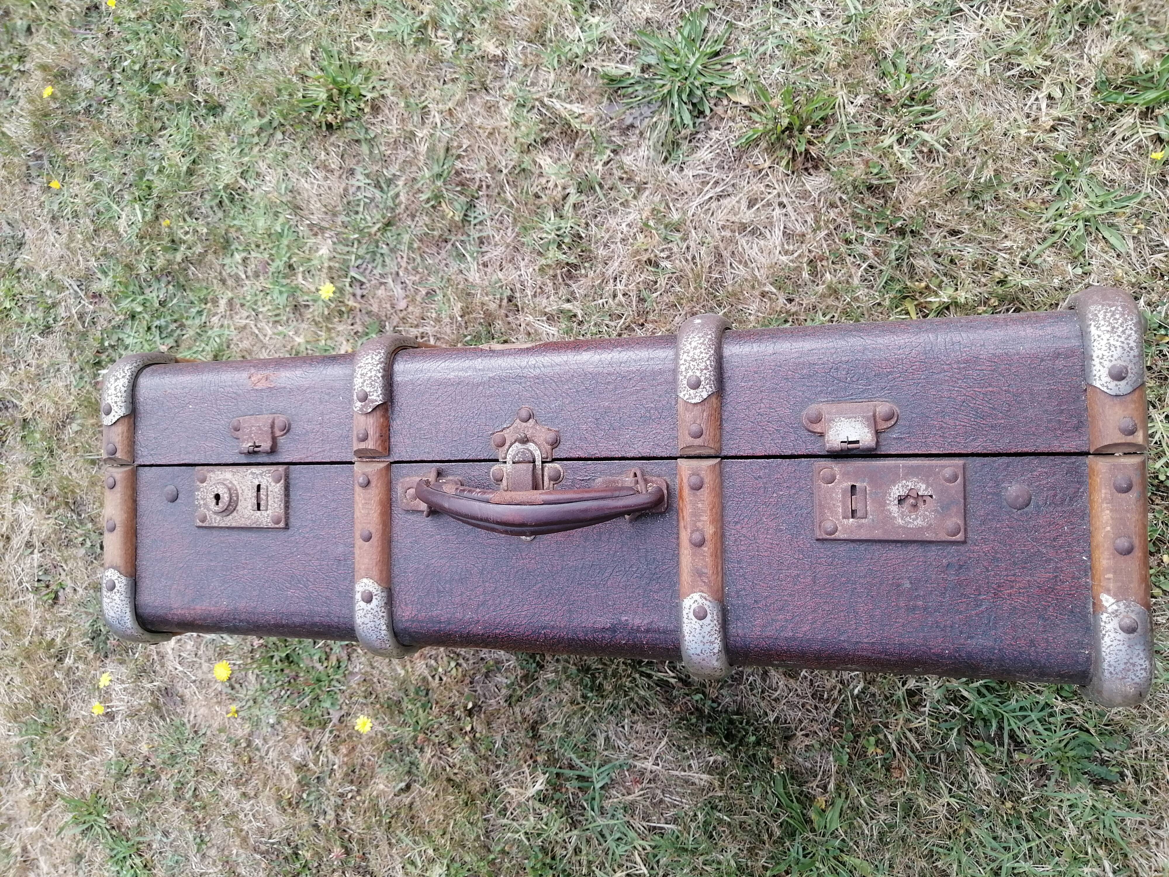 Antique suitcase in leather wood and vintage metal