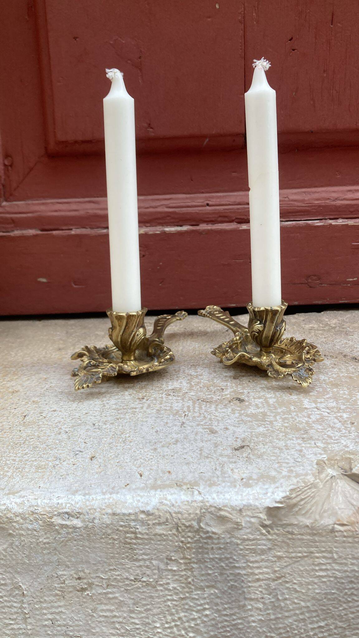Pair of hand candlesticks / bronze candle holders