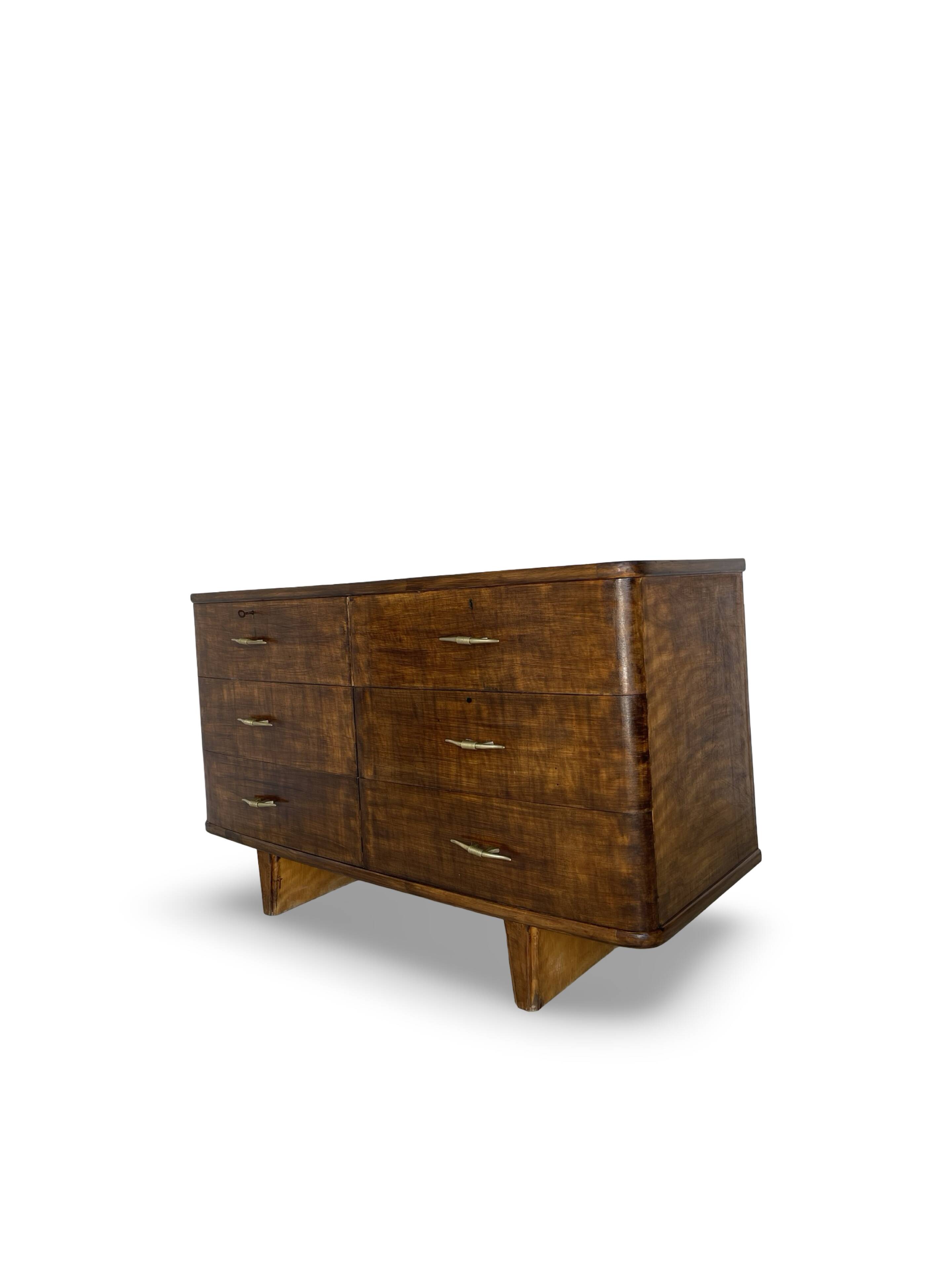 A vintage Italian chest of drawers, made of veneered walnut and solid wood,