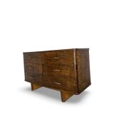 A vintage Italian chest of drawers, made of veneered walnut and solid wood,