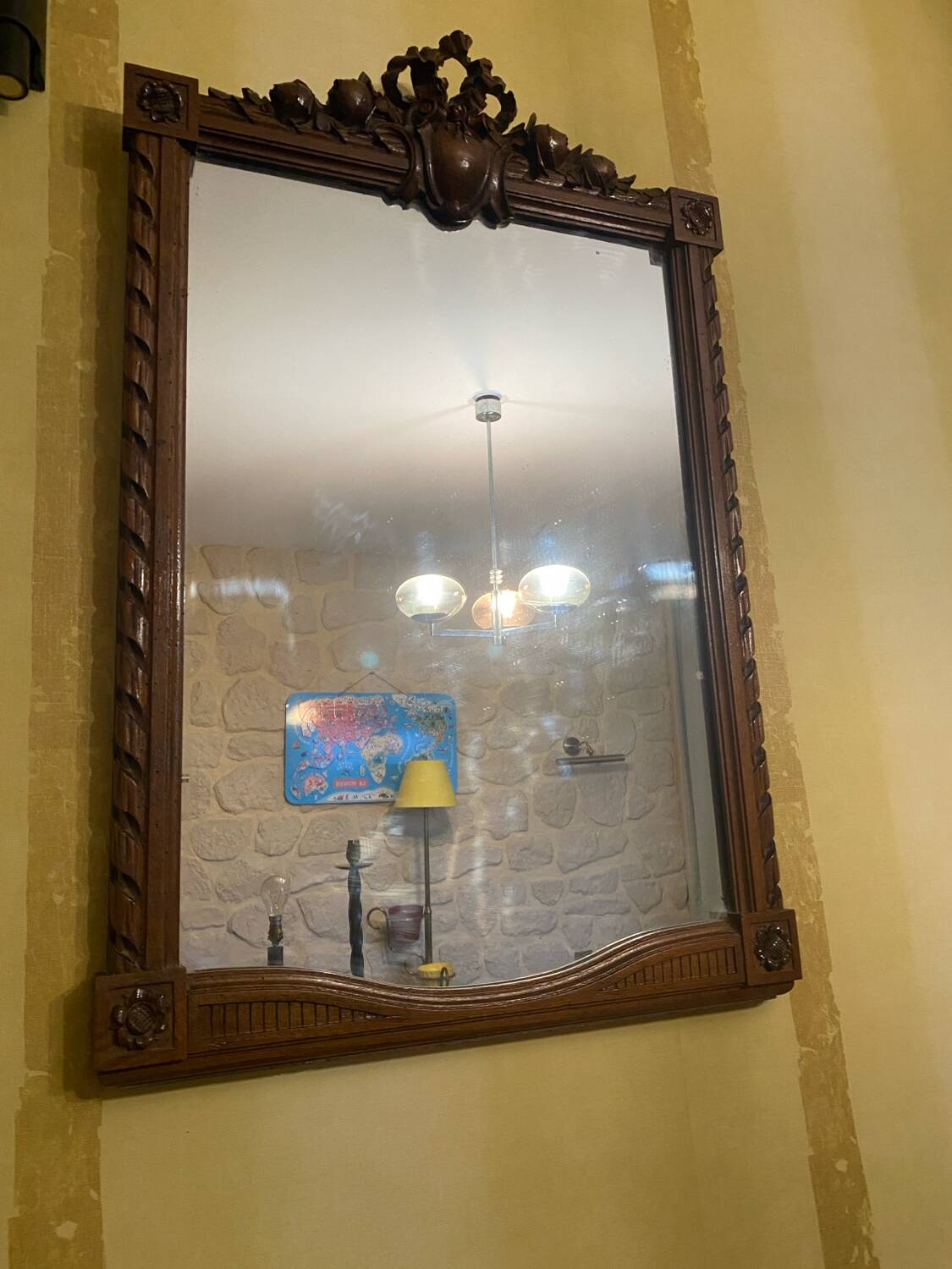 Carved wooden mirror in Louis XVI style