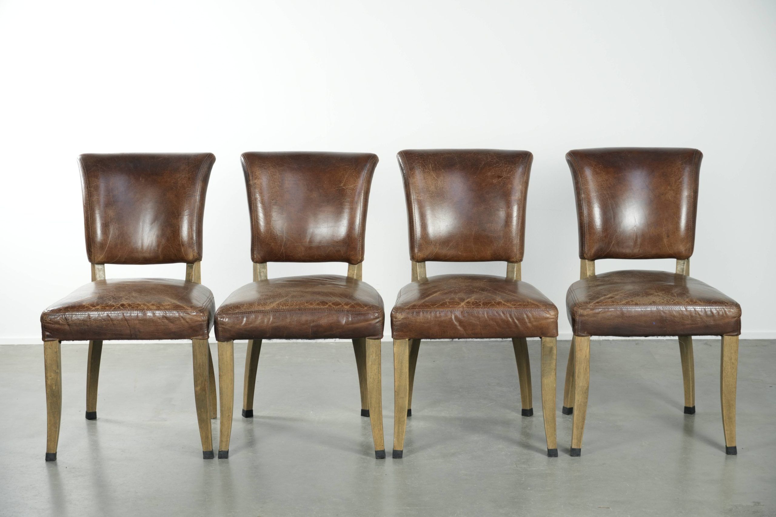 Set of 4 vintage cowhide and wooden dining chairs