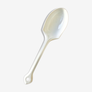 Old serving spoon in thick french porcelain