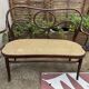 Antique Thonet bench in bent wood and caning, signed.