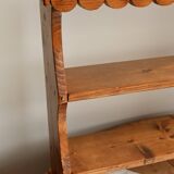 Vintage pine wall shelf with a scalloped front.