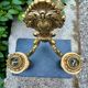 Wall light with 2 branches in baroque brass lion design.