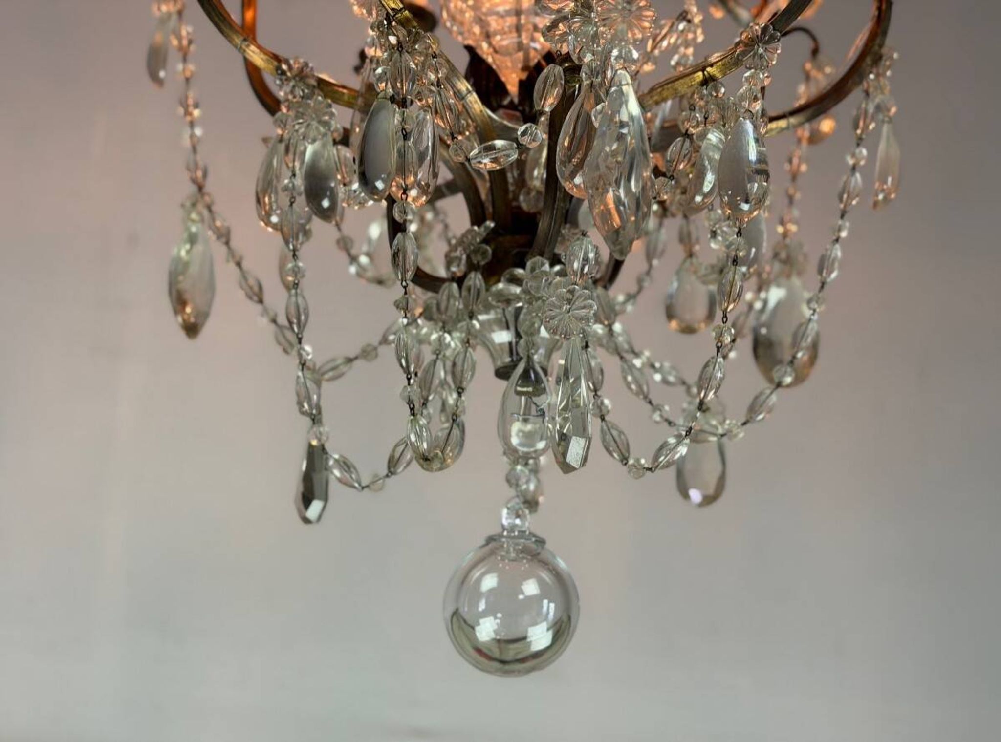 Bronze cage chandelier adorned with crystal drops, circa 1880