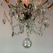Bronze cage chandelier adorned with crystal drops, circa 1880