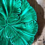 Plate with botanical leaves in green enameled earthenware from Clairfontaine circa 1890