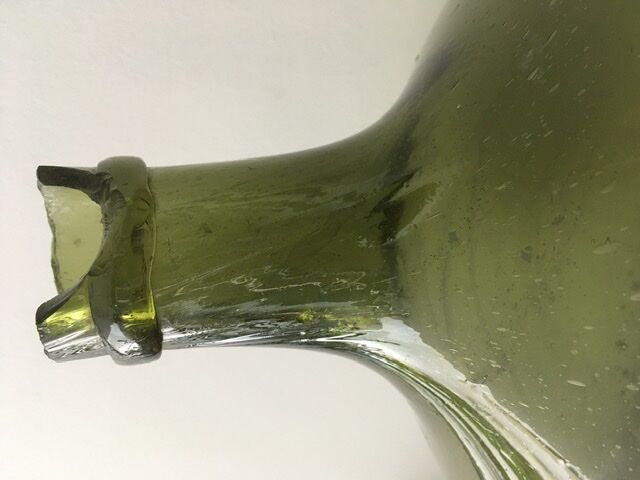 Old demijohn full of bubbles