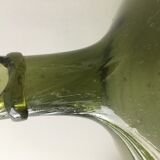 Old demijohn full of bubbles