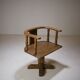 Swivel armchair in carved oak with ball bearings, early 20th century.