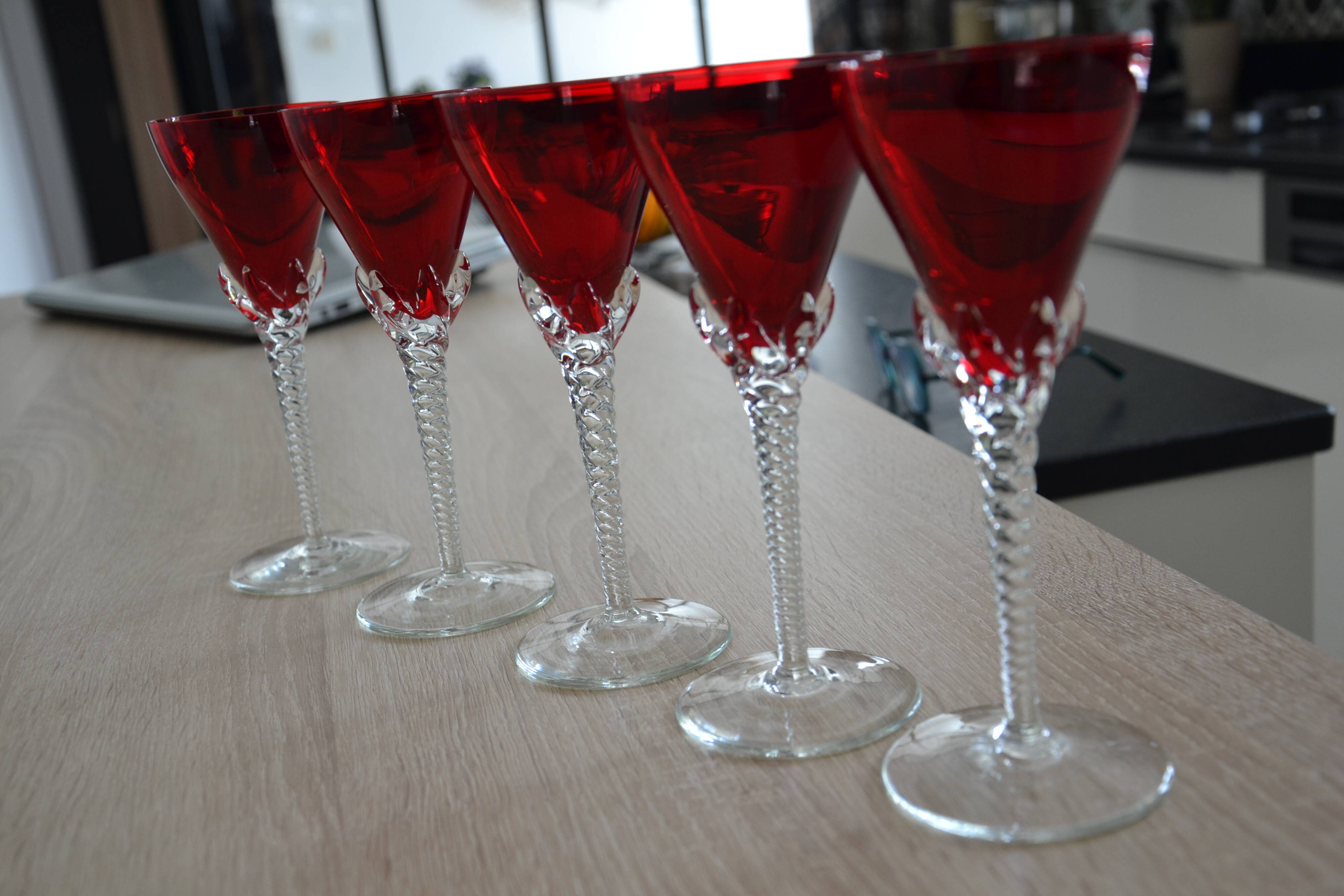5 red crystal glasses with twisted stems