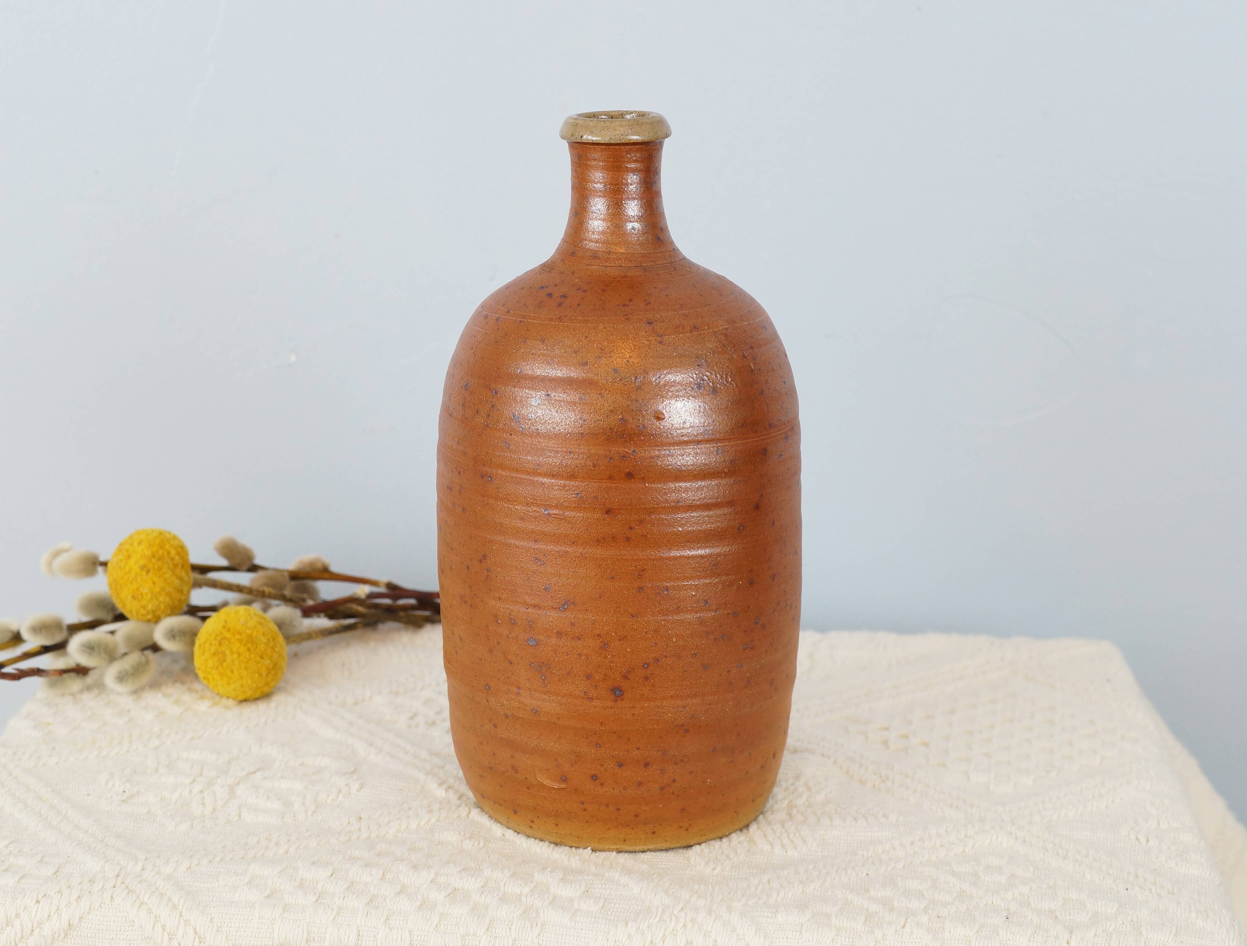 Bottle of vintage stoneware corsican brandy