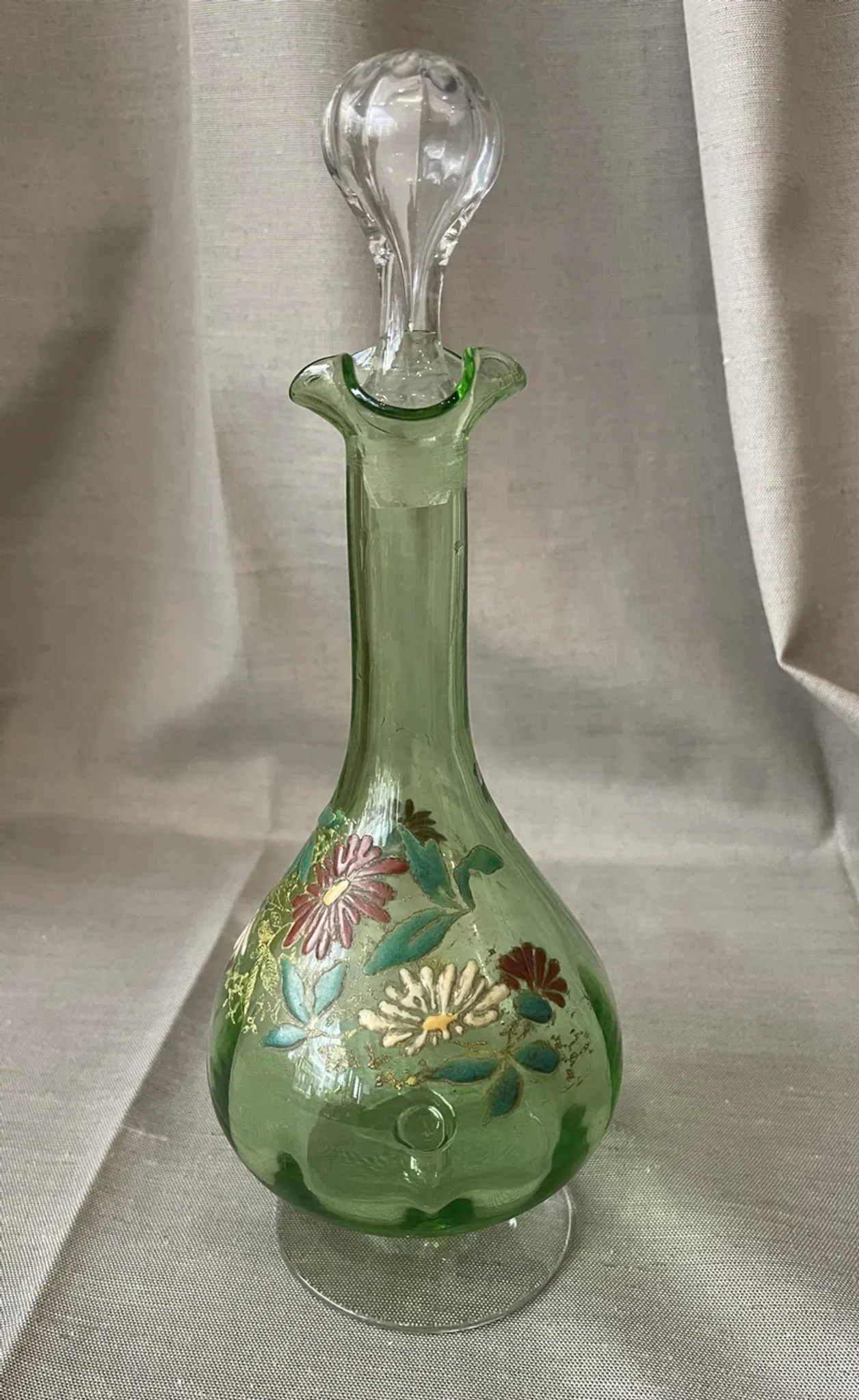 Liqueur carafe in ouraline with floral enamel decoration.