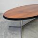 Danish Mid Century Modern oval coffee table with a teak top and chrome legs.