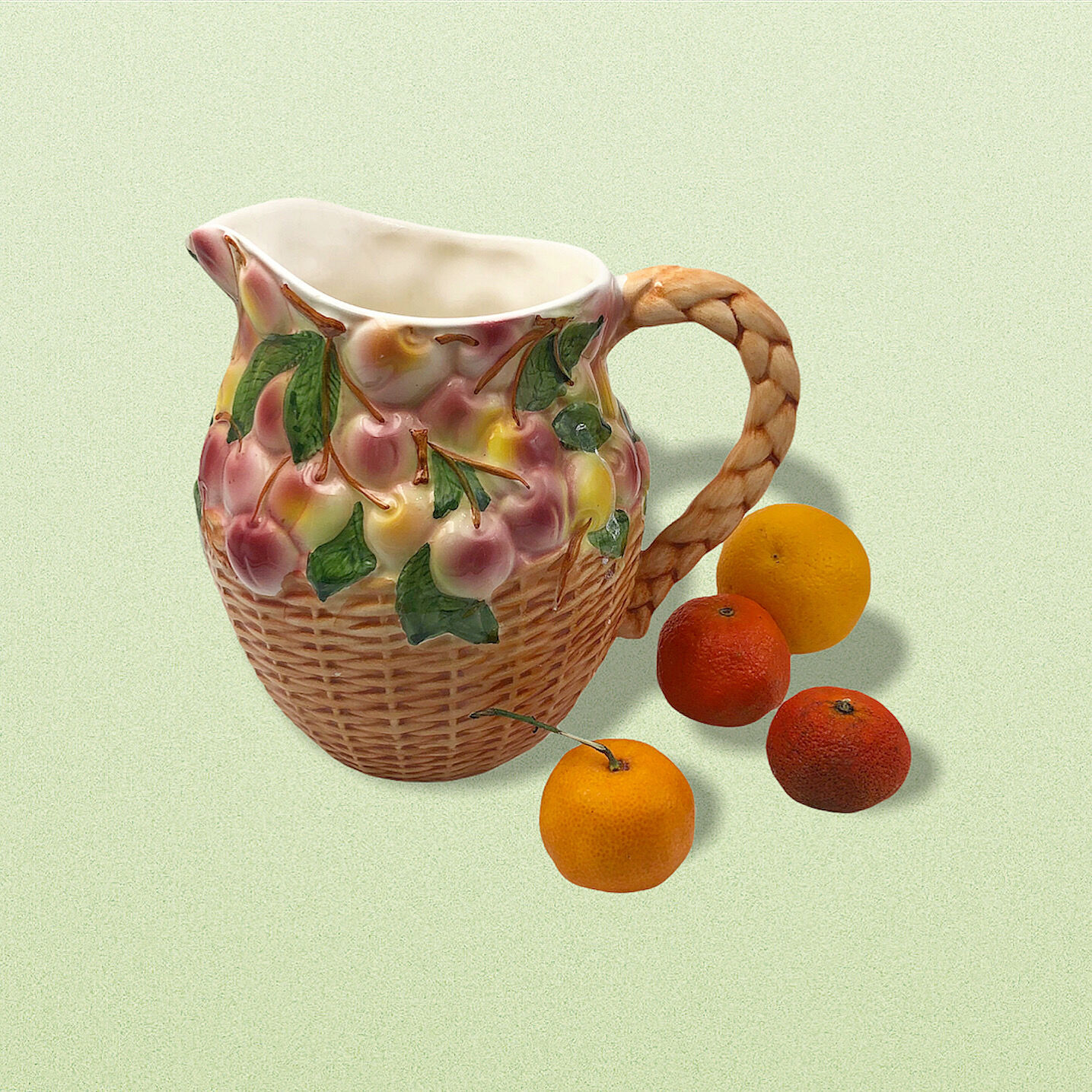 Vintage pitcher in cherry patterned dabbling