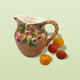 Vintage pitcher in cherry patterned dabbling