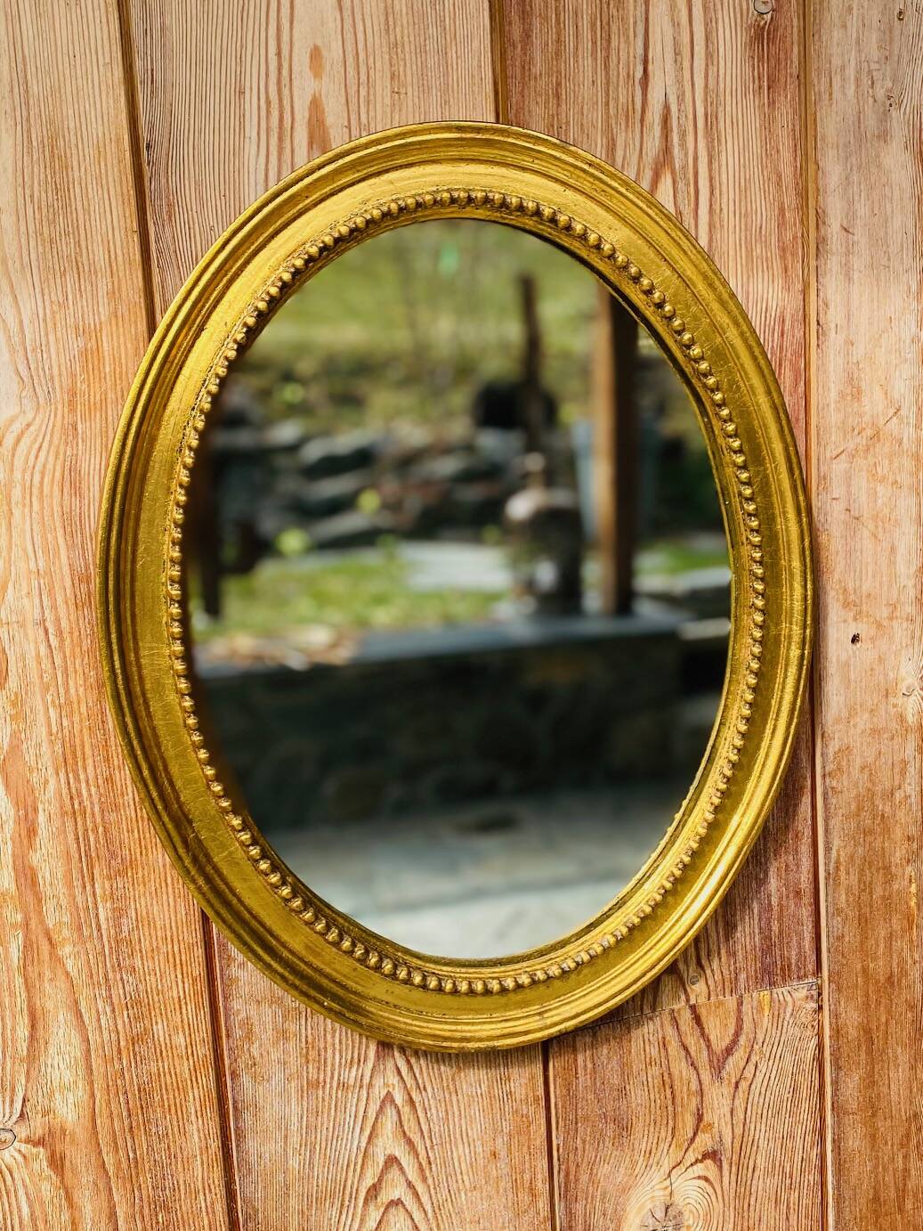 Antique gold oval mirror