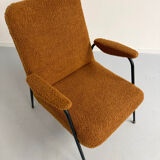Vintage orange boucle armchair, French design from the 1950s.