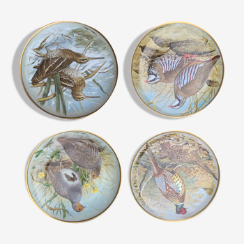 4 plates decorated with porcelain birds of limoges