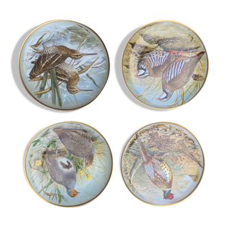 4 plates decorated with porcelain birds of limoges