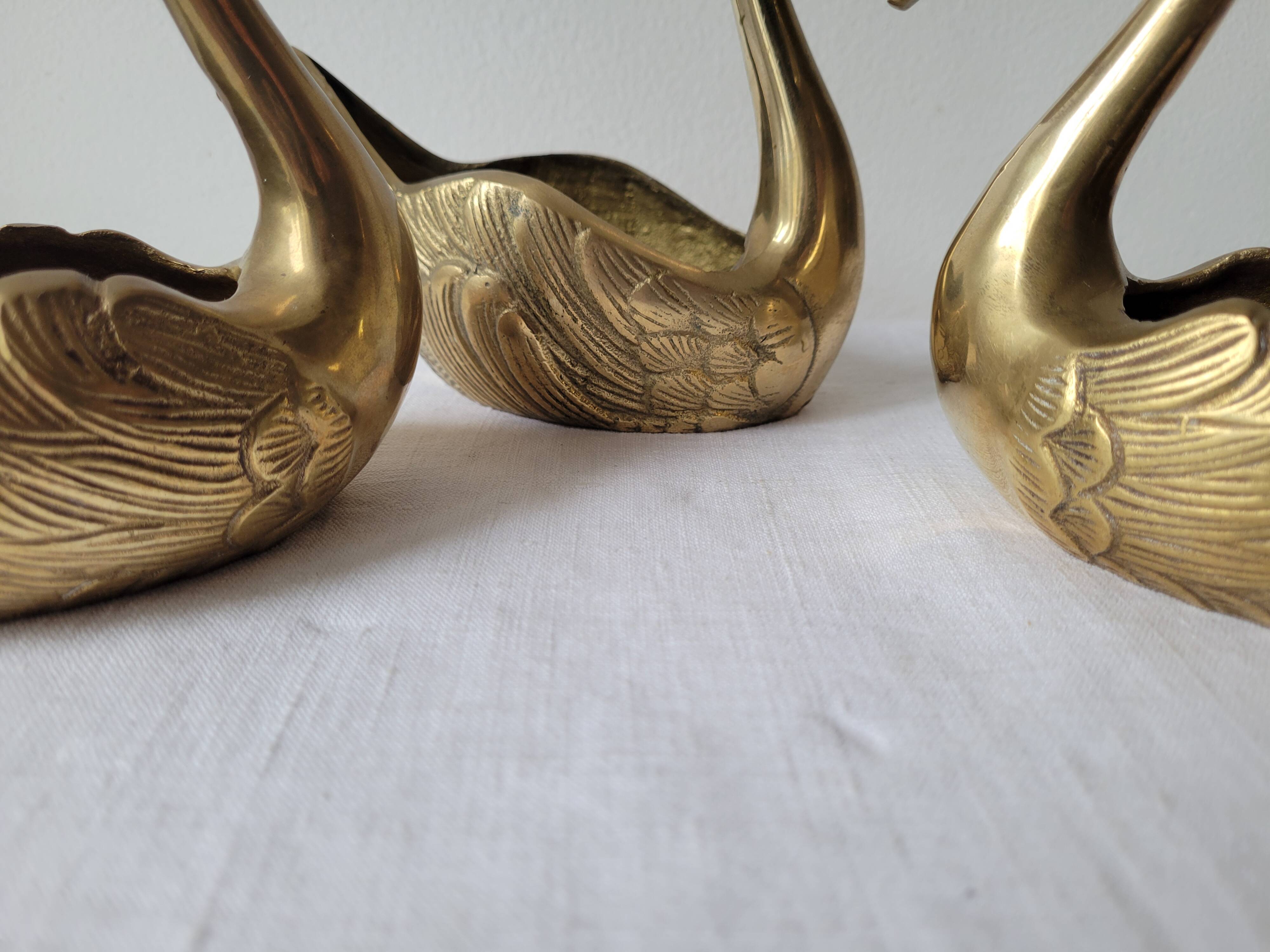 Trio of zoomorphic brass swan empty pockets