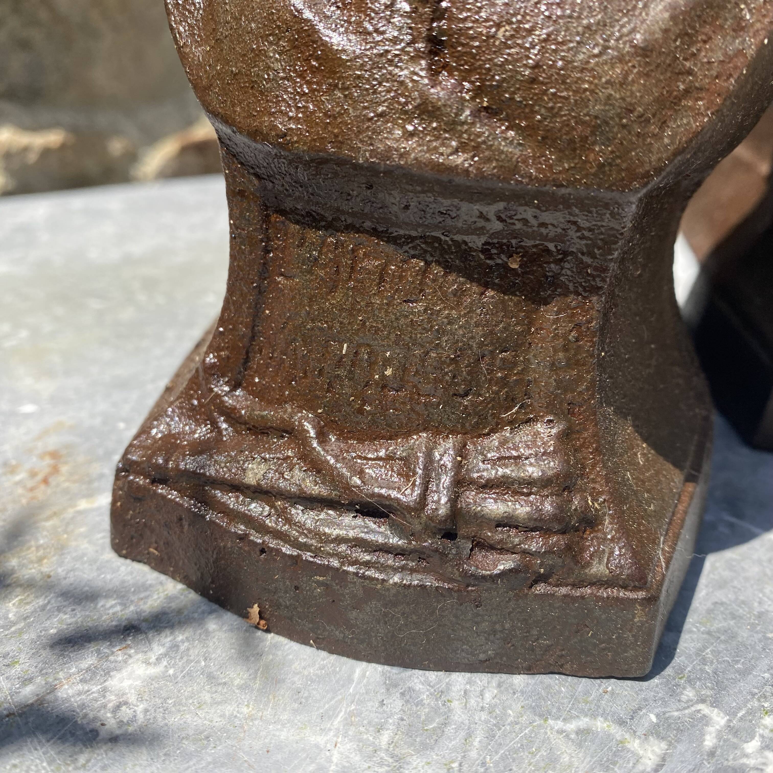 Pair of antique cast iron fire dogs "The Conquering Love"