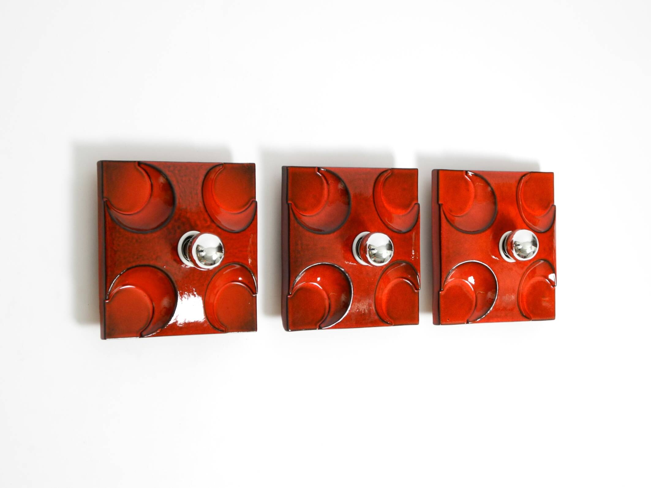 Three beautiful original 1970s Space Age red ceramic wall lamps