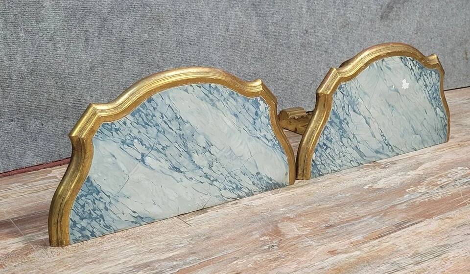 Pair of Louis XV style wall consoles in gilded wood