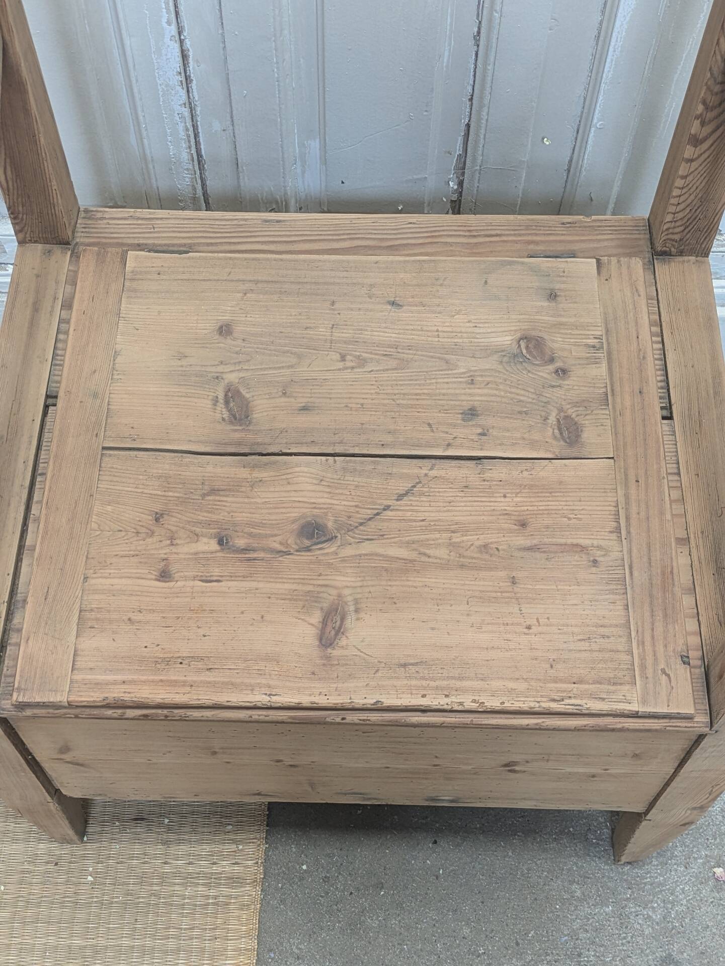 Antique armchair in raw wood