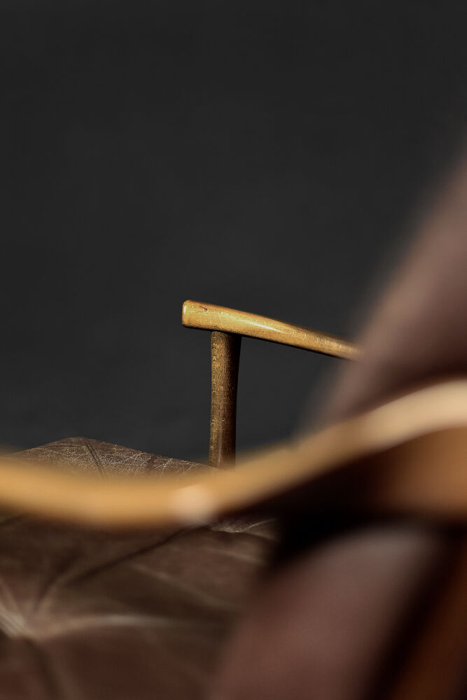 Modern vintage Danish armchair in beech and brown leather by Farstrup Møbler, 1970.