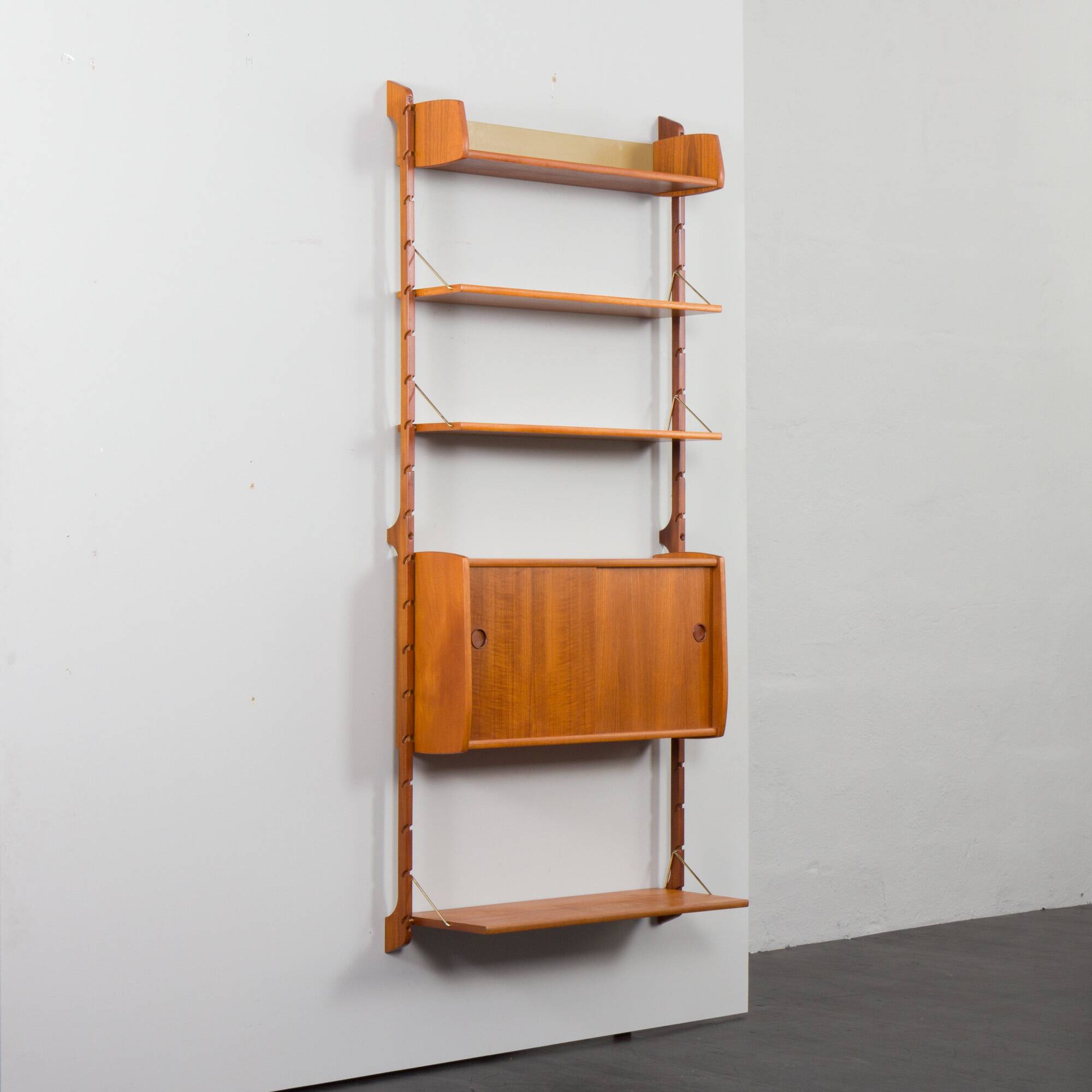 Scandinavian modern wall shelving system Ergo in teak by J. Texmon, Norway, 1960s