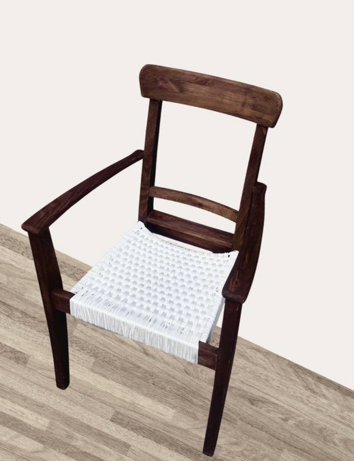 Scandinavian chair in wood and woven natural fibre.