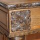 Antique fireplace from around 1880 in solid hand-carved elm with openwork columns.